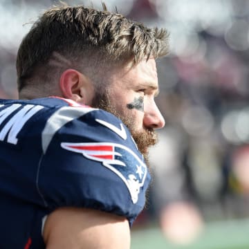 Dec 29, 2019; Foxborough, Massachusetts, USA;  New England Patriots wide receiver Julian Edelman (11) takes a knee during warmups prior to a game against the Miami Dolphins at Gillette Stadium