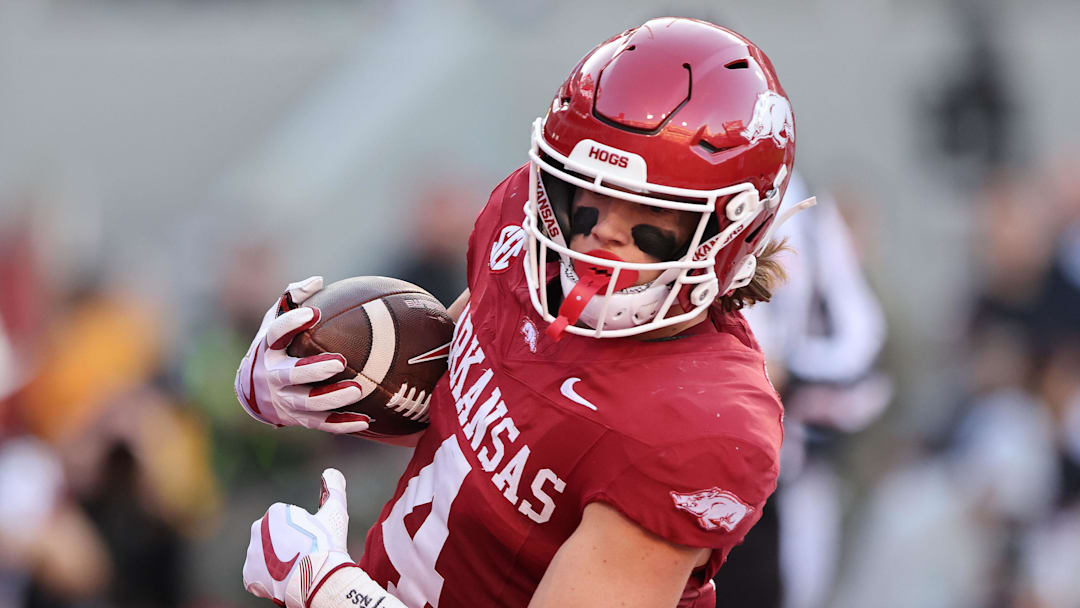 Arkansas Razorbacks wide receiver Isaac TeSlaa (4) scores a touchdown in the second quarter against the Louisiana Tech Bulldogs at Razorback Stadium.