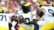 Sep 6, 2025; Norman, Oklahoma, USA; Michigan Wolverines quarterback Bryce Underwood (19) rolls out against the Oklahoma Sooners during the first half at Gaylord Family-Oklahoma Memorial Stadium. Mandatory Credit: Kevin Jairaj-Imagn Images