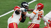 Feb 9, 2025; New Orleans, LA, USA; Kansas City Chiefs quarterback Patrick Mahomes (15) is sacked by Philadelphia Eagles defensive tackle Jalen Carter (98) and defensive tackle Milton Williams (93) during the fourth quarter in Super Bowl LIX at Caesars Superdome. Mandatory Credit: Kirby Lee-Imagn Images