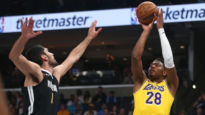 Mar 27, 2024; Memphis, Tennessee, USA; Los Angeles Lakers forward Rui Hachimura (28) shoots as Memphis Grizzlies forward-center Santi Aldama (7) defends during the first half at FedExForum.