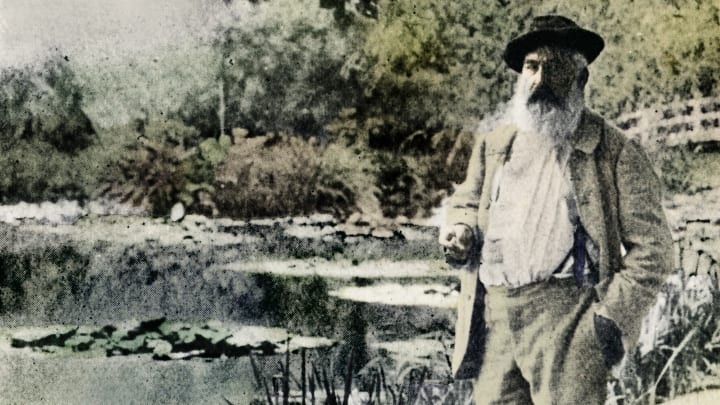 Claude Monet in front of the famous water lilies at his gardens in Giverny, 1905.