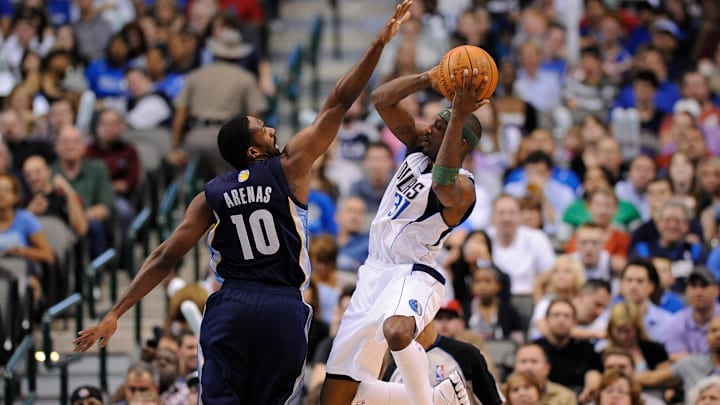 Apr 4, 2012; Dallas, TX, USA; Memphis Grizzlies point guard Gilbert Arenas (10) tries to block a shot by Dallas Mavericks shooting guard Jason Terry (31) during the third quarter at the American Airlines Center. The Mavericks defeated the Grizzlies 95-85. Mandatory Credit: Jerome Miron-Imagn Images