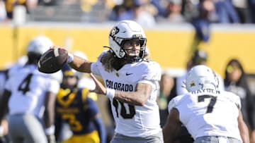 Nov 8, 2025; Morgantown, West Virginia, USA; Colorado Buffaloes quarterback Julian Lewis (10) throws a pass during the first quarter against the West Virginia Mountaineers at Milan Puskar Stadium. Mandatory Credit: Ben Queen-Imagn Images
