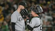 Chicago White Sox pitcher Sean Burke (59) speaks with catcher Matt Thaiss (29) against the Athletics at Sutter Health Park. 
