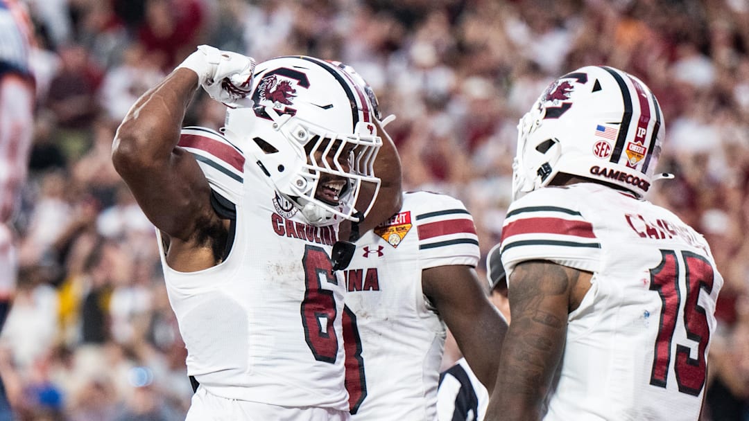 Dec 31, 2024; Orlando, FL, USA; South Carolina Gamecocks running back Dylan Stewart (6) celebrates his touchdown against the Illinois Fighting Illini in the fourth quarter at Camping World Stadium. Mandatory Credit: Jeremy Reper-Imagn Images