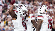 Dec 31, 2024; Orlando, FL, USA; South Carolina Gamecocks running back Dylan Stewart (6) celebrates his touchdown against the Illinois Fighting Illini in the fourth quarter at Camping World Stadium. Mandatory Credit: Jeremy Reper-Imagn Images