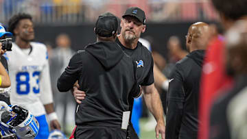 Aug 8, 2025; Atlanta, Georgia, USA; Detroit Lions head coach Dan Campbell and Atlanta Falcons head coach Raheem Morris react after the game was suspended after an injury to Lions safety Morice Norris (26) (not shown) during the game against the Atlanta Falcons at Mercedes-Benz Stadium. Mandatory Credit: Dale Zanine-Imagn Images