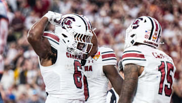 Dec 31, 2024; Orlando, FL, USA; South Carolina Gamecocks star Dylan Stewart (6) celebrates against the Illinois Fighting Illini in the fourth quarter at Camping World Stadium. Mandatory Credit: Jeremy Reper-Imagn Images