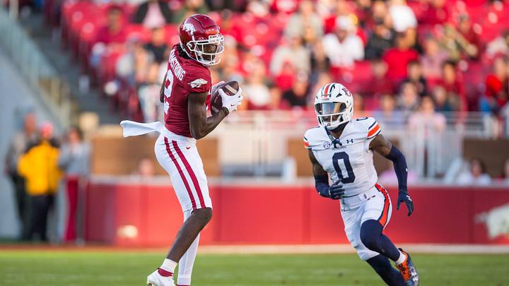 Nov 11, 2023; Fayetteville, Arkansas, USA;  Arkansas Razorbacks wide receiver Andrew Armstrong (2) makes a catch as Auburn Tigers cornerback Keionte Scott (0) defends during the second quarter at Donald W. Reynolds Razorback Stadium. Mandatory Credit: Brett Rojo-Imagn Images