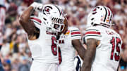 Dec 31, 2024; Orlando, FL, USA; South Carolina Gamecocks running back Dylan Stewart (6) celebrates his touchdown against the Illinois Fighting Illini in the fourth quarter at Camping World Stadium. Mandatory Credit: Jeremy Reper-Imagn Images