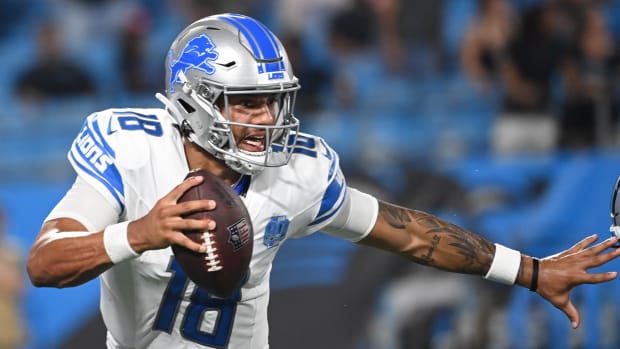 Detroit Lions quarterback Adrian Martinez (18) scrambles in the fourth quarter at Bank of America Stadium.