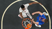 Apr 7, 2025; San Antonio, TX, USA;  Houston Cougars forward J'Wan Roberts (13) dunks against Florida Gators forward Alex Condon (21) in the second half in the national championship game of the Final Four of the 2025 NCAA Tournament at the Alamodome. Mandatory Credit: Robert Deutsch-Imagn Images
