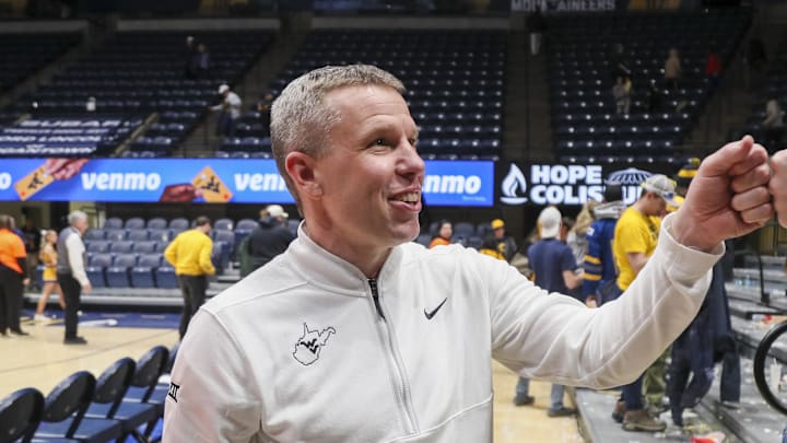 Jan 27, 2026; Morgantown, West Virginia, USA; West Virginia Mountaineers head coach Ross Hodge celebrates with fans after defeating the Kansas State Wildcats at Hope Coliseum. Mandatory Credit: Ben Queen-Imagn Imagesa