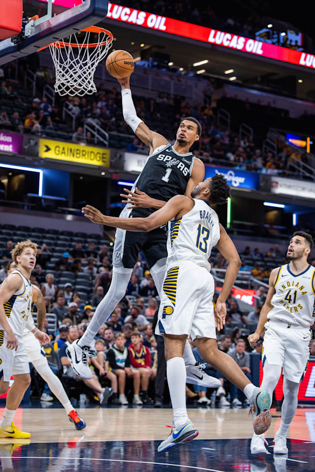 Spurs forward/center Victor Wembanyama (1) shoots the ball over Indiana Pacers center/forward Tony Bradley 