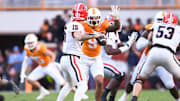 Tennessee defensive lineman Tyler Baron (9) defends Georgia quarterback Carson Beck (15) during a football game between Tennessee and Georgia at Neyland Stadium in Knoxville, Tenn., on Saturday, Nov. 18, 2023.