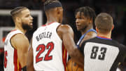 Nov 24, 2021; Minneapolis, Minnesota, USA; Miami Heat forward Jimmy Butler (22) and Minnesota Timberwolves forward Anthony Edwards (1) exchange some actions before each receiving a technical foul in the third quarter as referee Andy Nagy (83) and forward Caleb Martin (16) step in at Target Center. Mandatory Credit: Bruce Kluckhohn-USA TODAY Sports