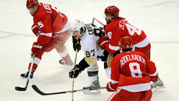 May 30, 2009; Detroit, MI, USA; Pittsburgh Penguins center Sidney Crosby (87) is shoved from behind by Detroit Red Wings center Henrik Zetterberg (40) in the third period of game one of the 2009 Stanley Cup finals at Joe Louis Arena.  The Red Wings won 3-1. Mandatory Credit: Leon Halip-Imagn Images