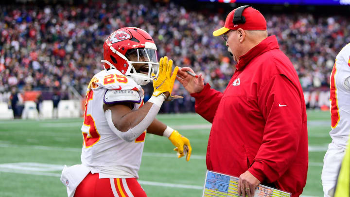 Dec 17, 2023; Foxborough, Massachusetts, USA; Kansas City Chiefs running back Clyde Edwards-Helaire (25) celebrates his touchdown with head coach Andy Reid during the second half against the New England Patriots at Gillette Stadium. Mandatory Credit: Eric Canha-USA TODAY Sports