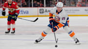 Feb 2, 2025; Sunrise, Florida, USA; New York Islanders center Brock Nelson (29) moves the puck against the Florida Panthers during the first period at Amerant Bank Arena. Mandatory Credit: Sam Navarro-Imagn Images