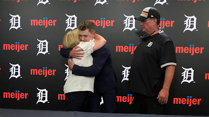 (L to R) Tracy McGonigle hugs her son Kevin McGonigle and his father Kevin McGonigle looks on after his press conference on Wednesday, April, 15, 2026 at Comerica Park.
The Detroit Tigers and the 21-year-old rookie infielder agreed Wednesday, April 15, to an eight-year, $150 million contract extension.
The deal includes a $14 million signing bonus.