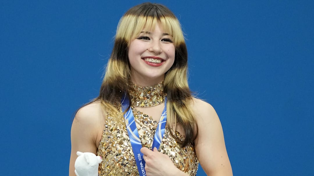 Feb 19, 2026; Milan, Italy; Alysa Liu of the United States celebrates with the gold medal during the medal ceremony for the women's free skate during the Milano Cortina 2026 Olympic Winter Games at Milano Ice Skating Arena.