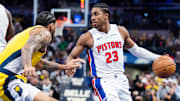 Nov 29, 2024; Indianapolis, Indiana, USA; Detroit Pistons guard Jaden Ivey (23) dribbles the ball while Indiana Pacers forward Obi Toppin (1) defends in the second half  at Gainbridge Fieldhouse. Mandatory Credit: Trevor Ruszkowski-Imagn Images