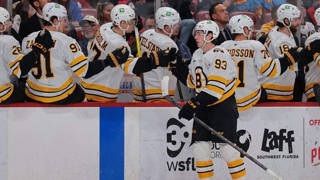 Apr 2, 2026; Sunrise, Florida, USA; Boston Bruins center Fraser Minten (93) celebrates with teammates after scoring against the Florida Panthers during the first period at Amerant Bank Arena. Mandatory Credit: Sam Navarro-Imagn Images