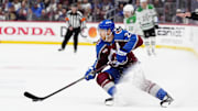 May 1, 2025; Denver, Colorado, USA; Colorado Avalanche center Nathan MacKinnon (29) controls the puck in the second period against the Dallas Stars in game six of the first round of the 2025 Stanley Cup Playoffs at Ball Arena. Mandatory Credit: Ron Chenoy-Imagn Images
