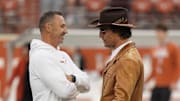 Nov 1, 2025; Austin, Texas, USA; Texas Longhorns head coach Steve Sarkisian shares laughs with actor Matthew McConaughey before a game against the Vanderbilt Commodores at Darrell K Royal-Texas Memorial Stadium. Mandatory Credit: Scott Wachter-Imagn Images