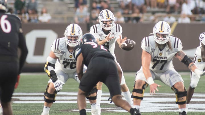 Western Michigan lineman Jacob Gideon snaps the ball to quarterback Jack Salopek during the season opening game against Saint Francis at Waldo Stadium on Thursday, Aug. 31, 2023.