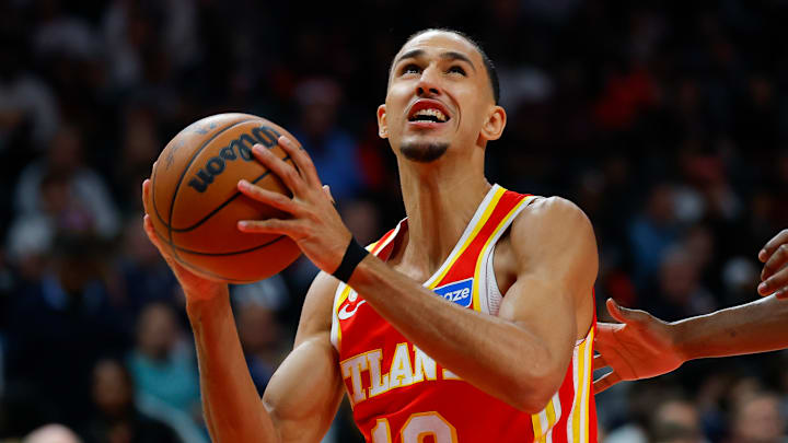 Hawks forward Zaccharie Risacher goes up for a shot in a game against the Raptors.