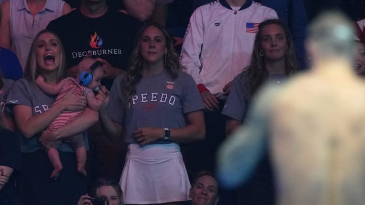 Meghan Dressel reacts after Caeleb Dressel wins in the 100-meter butterfly final, Saturday, June 22, 2024, during the eighth day of the U.S. Olympic Team Swimming Trials at Lucas Oil Stadium in Indianapolis.