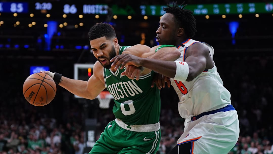 May 7, 2025; Boston, Massachusetts, USA; New York Knicks forward OG Anunoby (8) defends against Boston Celtics forward Jayson Tatum (0) in the fourth quarter during game two of the second round for the 2025 NBA Playoffs at TD Garden. Mandatory Credit: David Butler II-Imagn Images