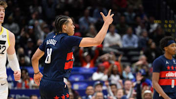 Mar 5, 2025; Washington, District of Columbia, USA; Washington Wizards forward Kyshawn George (18) reacts after a made shot during the third quarter against the Utah Jazz at Capital One Arena. Mandatory Credit: Reggie Hildred-Imagn Images