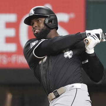 Chicago White Sox outfielder Luis Robert Jr. (88) swings against the Texas Rangers at Globe Life Field. 