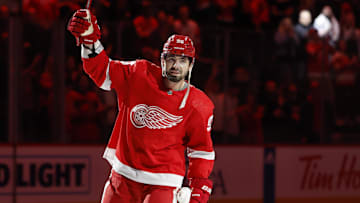 Feb 10, 2024; Detroit, Michigan, USA;  Detroit Red Wings defenseman Jake Walman (96) is named one of the three stars of the game against Vancouver Canucks goaltender Casey DeSmith (29) in overtime at Little Caesars Arena. Mandatory Credit: Rick Osentoski-Imagn Images