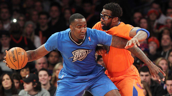 Dec 25, 2013; New York, NY, USA; Oklahoma City Thunder center Kendrick Perkins (5) controls the ball against New York Knicks power forward Amar'e Stoudemire (1) during the third quarter of a game at Madison Square Garden. The Thunder defeated the Knicks 123-94. Mandatory Credit: Brad Penner-Imagn Images