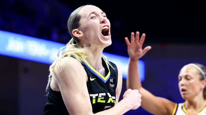 Aug 15, 2025; Arlington, Texas, USA;  Dallas Wings guard Paige Bueckers (5) reacts in front of Los Angeles Sparks guard Julie Allemand (20) during the second half at College Park Center. Mandatory Credit: Kevin Jairaj-Imagn Images