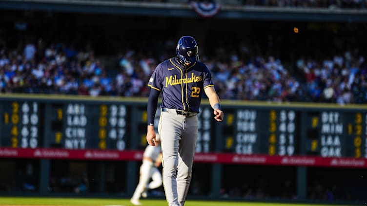 Jul 4, 2024; Denver, Colorado, USA; Milwaukee Brewers left fielder Christian Yelich (22) walks off the filed against the Colorado Rockies during the fifth inning at Coors Field. Mandatory Credit: Troy Babbitt-USA TODAY Sport