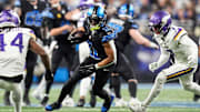 Detroit Lions wide receiver Kalif Raymond (11) runs against Minnesota Vikings cornerback Byron Murphy Jr. (7), right, and safety Josh Metellus (44) during the first half at Ford Field in Detroit on Sunday, Jan. 5, 2025.