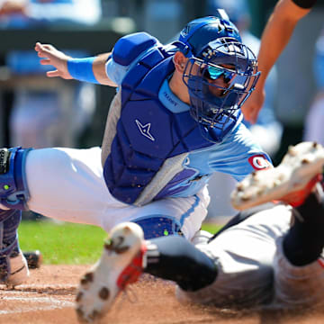 Sep 8, 2024; Kansas City, Missouri, USA; Minnesota Twins first baseman Jose Miranda (64) is tagged out at home by Kansas City Royals catcher Freddy Fermin (34) during the first inning at Kauffman Stadium. Mandatory Credit: Jay Biggerstaff-Imagn Images