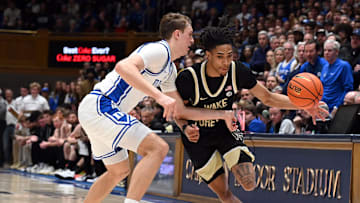 Mar 3, 2025; Durham, North Carolina, USA;  Wake Forest Demon Deacons guard Hunter Sallis (23) drives to the basket as Duke basketball forward Cooper Flagg (2) defends during the first half at Cameron Indoor Stadium.