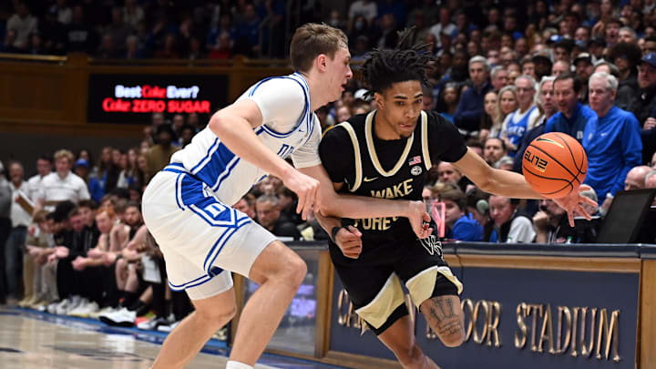 Mar 3, 2025; Durham, North Carolina, USA;  Wake Forest Demon Deacons guard Hunter Sallis (23) drives to the basket as Duke basketball forward Cooper Flagg (2) defends during the first half at Cameron Indoor Stadium.