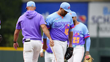Aug 1, 2025; Denver, Colorado, USA; Colorado Rockies interim manager Warren Schaeffer (34) pulls starting pitcher Antonio Senzatela (49) in the first inning against the Pittsburgh Pirates at Coors Field. 