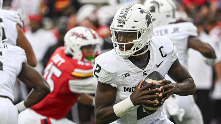 Sep 7, 2024; College Park, Maryland, USA;  Michigan State Spartans quarterback Aidan Chiles (2) rolls pit top pass during the first half against the Maryland Terrapins at SECU Stadium. Mandatory Credit: Tommy Gilligan-Imagn Images