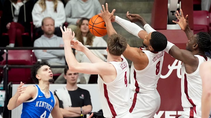 Feb 22, 2025; Tuscaloosa, AL, USA; Kentucky guard Koby Brea (4) watches Alabama forward Grant Nelson (4) and Alabama guard Chris Youngblood (8) bat a rebound his way at Coleman Coliseum. Alabama defeated Kentucky 96-83. Mandatory Credit: Gary Cosby Jr.-Tuscaloosa News