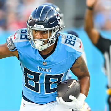 Aug 10, 2024; Nashville, Tennessee, USA;  Tennessee Titans tight end David Martin-Robinson (88) runs through San Francisco 49ers cornerback Rock Ya-Sin (33) during the first half at Nissan Stadium. Mandatory Credit: Steve Roberts-Imagn Images