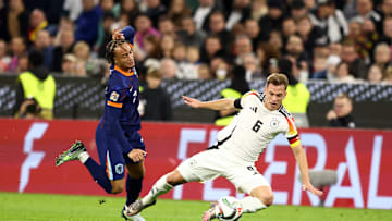 Joshua Kimmich wins the ball off of Xavi Simons