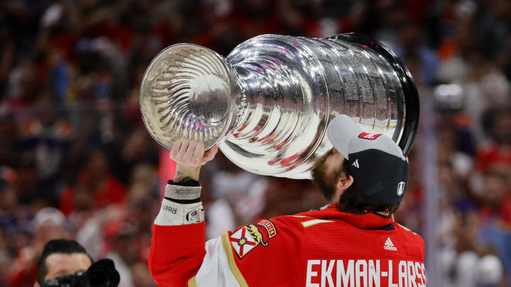 Jun 24, 2024; Sunrise, Florida, USA; Florida Panthers defenseman Oliver Ekman-Larsson (91) kisses the cup after winning game seven of the 2024 Stanley Cup Final against the Edmonton Oilers at Amerant Bank Arena. Mandatory Credit: Sam Navarro-USA TODAY Sports